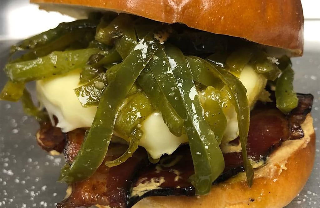 brioche bun with egg, Anaheim chiles, and bacon